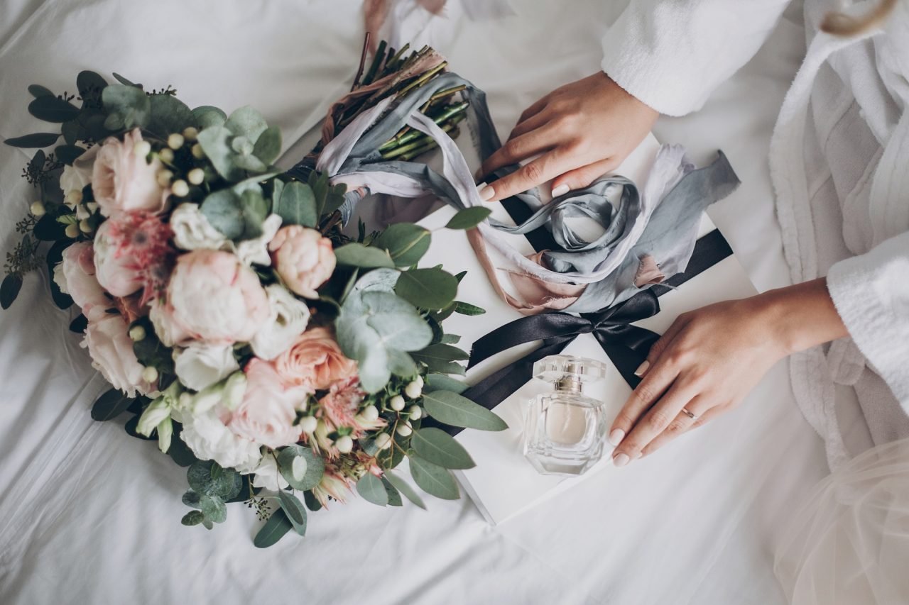 modern wedding bouquet with perfume bottle