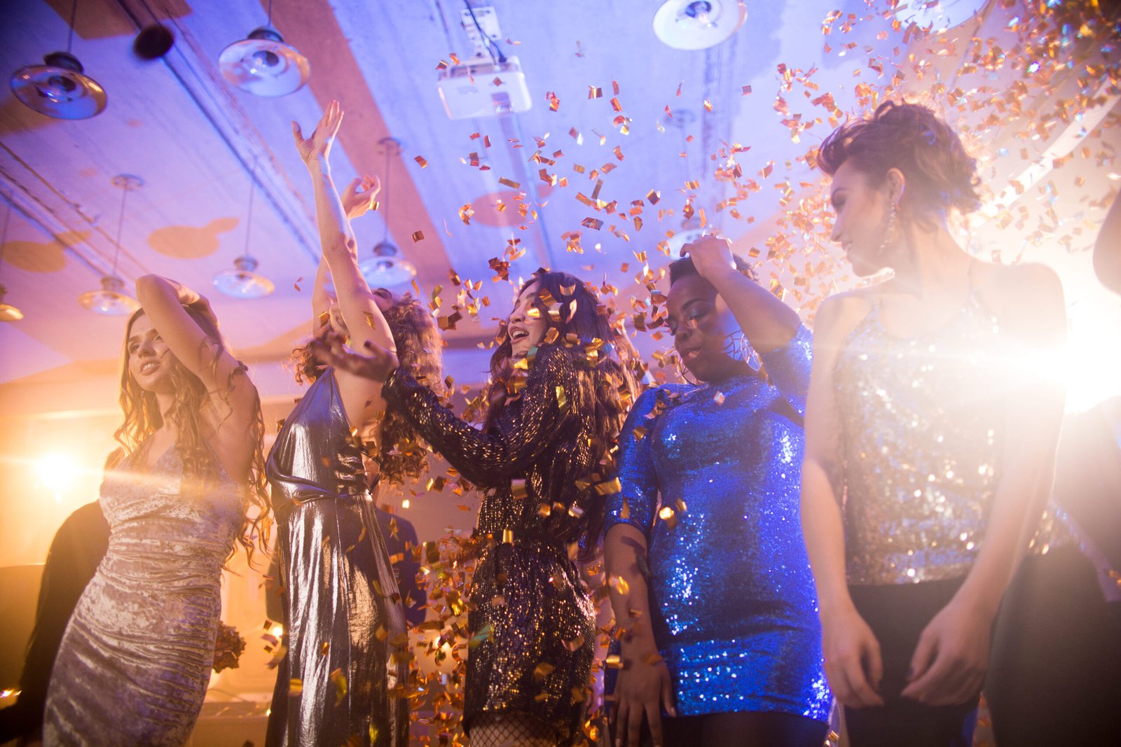 A group of young people dancing at a vibrant rave party